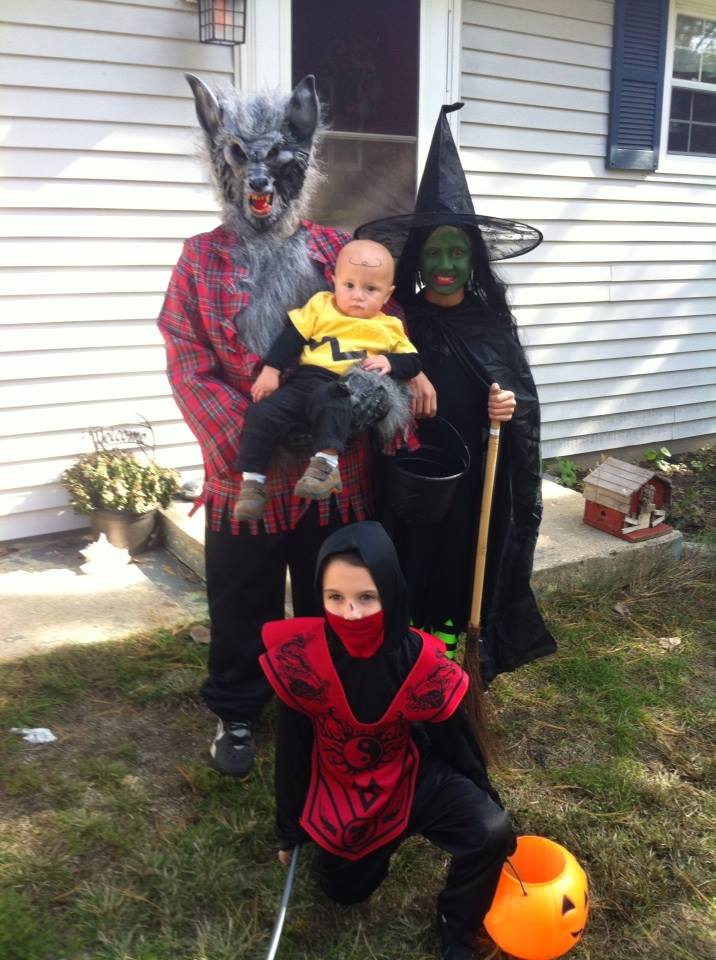 My three kids and nephew in Halloween costumes.